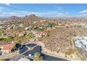 Aerial view of home showcasing the surrounding desert landscape and mountain views at 13221 N 17Th Pl, Phoenix, AZ 85022