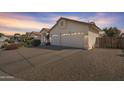 Spacious two-car garage and extended driveway on a well-maintained home at 14955 N 78Th Dr, Peoria, AZ 85381