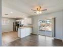 Bright, eat-in kitchen with stainless steel appliances and access to the backyard at 1510 S Lawther Dr, Apache Junction, AZ 85120