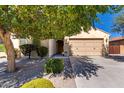 Charming single-Gathering home featuring a well-manicured front yard and a two-car garage at 16966 W Rio Vista Ln, Goodyear, AZ 85338