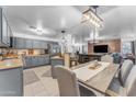 Bright, open-concept kitchen and dining area with stainless steel appliances at 22491 W Woodlands Ave, Buckeye, AZ 85326