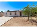 Charming single-story home featuring a well-maintained exterior and a neatly landscaped front yard at 3035 W Pierce St, Phoenix, AZ 85009
