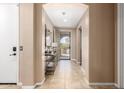Inviting entryway showcasing neutral tones, tile flooring, and an open view to the front door at 3103 S Dakota Pl, Chandler, AZ 85248