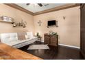 Cozy living room featuring dark hardwood floors, a modern sofa, and stylish decor at 3103 S Dakota Pl, Chandler, AZ 85248