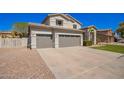 Attractive two-story home with a three-car garage, desert landscaping, and a spacious driveway at 3730 E Diamond Ct, Gilbert, AZ 85297