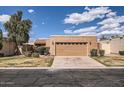 Charming single-story home featuring a 2-car garage, stucco siding and manicured landscaping at 482 Leisure World --, Mesa, AZ 85206
