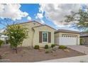 Attractive single-story home with desert landscaping and attached two-car garage at 5189 N 206Th Dr, Buckeye, AZ 85396