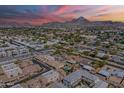 Expansive aerial view showcasing the neighborhood, mountain views and sunset at 6223 N 12Th St # 8, Phoenix, AZ 85014