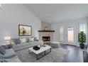Cozy living room featuring a stone fireplace and comfortable seating at 6223 N 12Th St # 8, Phoenix, AZ 85014