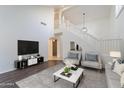 Bright living room with high ceilings, elegant decor, and a staircase at 6223 N 12Th St # 8, Phoenix, AZ 85014