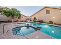 Community pool and hot tub with easy access from the surrounding condos on a sunny day at 6223 N 12Th St # 8, Phoenix, AZ 85014