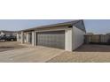 Spacious two-car garage with a gray door, adjacent to the home's entryway at 6808 W Sierra St, Peoria, AZ 85345