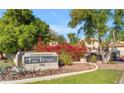 Well maintained Las Brisas Condominium community sign surrounded by lush landscaping at 750 E Northern Ave # 1079, Phoenix, AZ 85020