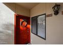Inviting front door featuring a wreath, sidelight window, and unit number at 750 E Northern Ave # 1079, Phoenix, AZ 85020