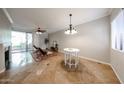 Open-concept living area with tile floors, fireplace, and sliding doors to the outdoor space at 750 E Northern Ave # 1079, Phoenix, AZ 85020