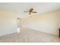 Bright living room offers tile flooring and a ceiling fan for added comfort at 931 W Hermosa Dr, Tempe, AZ 85282