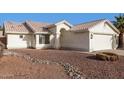 Attractive single-story home with low-maintenance desert landscaping in the front yard at 11951 N 69Th Ave, Peoria, AZ 85345