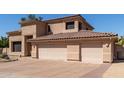 A spacious three-car garage with a red tiled roof, complementing the home's exterior at 12442 N Via La Playa --, Fountain Hills, AZ 85268