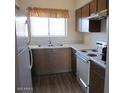 Functional kitchen featuring essential appliances, ample counter space, and warm wood cabinetry at 16528 E Gunsight Dr # 206, Fountain Hills, AZ 85268