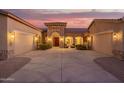Elegant home with two-car garages and a stone entrance, perfect for any homeowner at 3211 E Ian Dr, Phoenix, AZ 85042