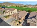 Aerial view of home located on a golf course with mountain views at 3517 N Paseo Del Sol --, Mesa, AZ 85207