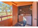 Balcony featuring a washer, dryer and a view of the golf course at 4303 E Cactus Rd # 326, Phoenix, AZ 85032