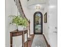 Inviting foyer featuring hardwood floors, an ornate front door, and a curved staircase at 4639 N 29Th St, Phoenix, AZ 85016