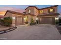 Charming two-story home with a three-car garage and well-manicured landscaping at 4979 E Colonial Dr, Chandler, AZ 85249