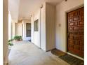 Inviting condo with a decorative wood door and a cozy outdoor entryway at 5200 S Lakeshore Dr # 106, Tempe, AZ 85283