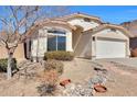 A well-maintained single-story home displays a tidy front yard with desert landscaping and a two-car garage at 6408 W Prickly Pear Trl, Phoenix, AZ 85083