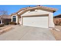 Inviting single-level home featuring a two-car garage, desert landscaping, and a well-maintained facade at 6408 W Prickly Pear Trl, Phoenix, AZ 85083