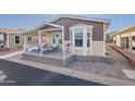 A delightful home with a bay window and fenced front patio, perfect for curb appeal at 650 N Hawes Rd # 2873, Mesa, AZ 85207