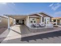 Inviting home featuring a covered carport and a charming patio area for outdoor enjoyment at 650 N Hawes Rd # 2873, Mesa, AZ 85207