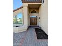 Beautiful front entrance with double doors, a high ceiling and a curved window at 6901 W Marco Polo Rd, Glendale, AZ 85308