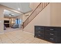 Entryway with tile flooring, staircase, and living room view at 10421 W Via Del Sol -- # 379, Peoria, AZ 85383