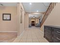 Bright entryway with tile flooring that leads to the living room and staircase at 10421 W Via Del Sol -- # 379, Peoria, AZ 85383