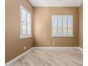 Bright bedroom with shuttered windows, baseboards, and a neutral color palette, creating a calm and inviting atmosphere at 1474 E Elysian Pass, Queen Creek, AZ 85140