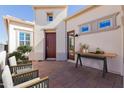 Inviting front entrance with a stylish patio and cozy seating area at 1474 E Elysian Pass, Queen Creek, AZ 85140