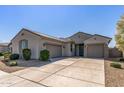 Charming single-story home features a three-car garage and well-maintained landscaping in a desirable neighborhood at 18369 W La Senda Dr, Surprise, AZ 85387