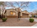 Inviting one-story house with a two-car garage, low-maintenance landscaping, and classic architectural details at 2110 S 102Nd Ln, Tolleson, AZ 85353