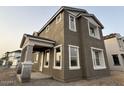Newly built two-story home with crisp white trim, contemporary design, and a welcoming covered porch at 2232 W Chisum Trl, Phoenix, AZ 85085