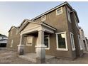 New construction home showcasing a modern exterior, covered entryway, and well-defined architectural lines at 2232 W Chisum Trl, Phoenix, AZ 85085