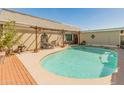 A serene backyard swimming pool with a spacious patio area at 2349 W Shaw Butte Dr, Phoenix, AZ 85029