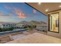 Balcony view of the community and local mountains with views of the sink, cabinets, and window at 26885 N 87Th Dr, Peoria, AZ 85383