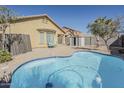 Inviting backyard oasis with a private pool, patio area, and secure fencing at 36307 W El Greco St, Maricopa, AZ 85138