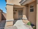 Inviting front porch with decorative metalwork and neutral color scheme enhances curb appeal at 41310 N Clear Crossing Ct, Anthem, AZ 85086