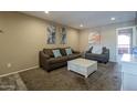 Inviting living room featuring neutral walls and cozy furniture at 4303 E Cactus Rd # 308B, Phoenix, AZ 85032