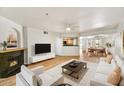 Inviting living room showcasing a sleek fireplace, comfortable seating, and an open layout leading to the dining area at 5104 N 32Nd St # 431, Phoenix, AZ 85018