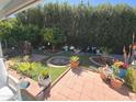 Beautiful backyard showcasing manicured landscaping, a variety of plants, and a peaceful outdoor retreat at 654 S 83Rd Way, Mesa, AZ 85208