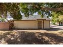 Front exterior of home showcasing mature tree with shade at 6604 W Kingston Ln, Glendale, AZ 85306